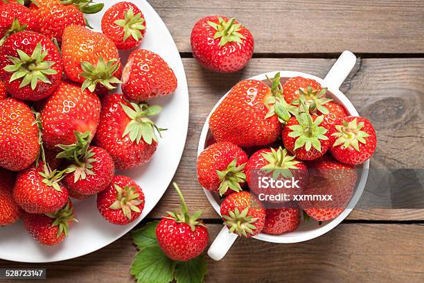 Strawberries On Old Wooden Table Stock Photo - Download Image Now - Above, Berry Fruit, Bowl