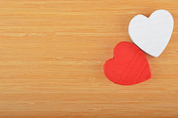 istock Heart on wooden background 528723174
