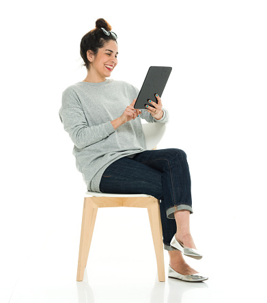 Woman using digital tablethttp://www.twodozendesign.info/i/1.png