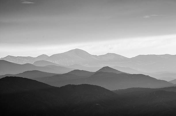 Rocky Mountains in Black and White Silhouette The ridges of the Rocky Mountains are layers of silhouettes when backlit by the evening sun colorado photos stock pictures, royalty-free photos & images
