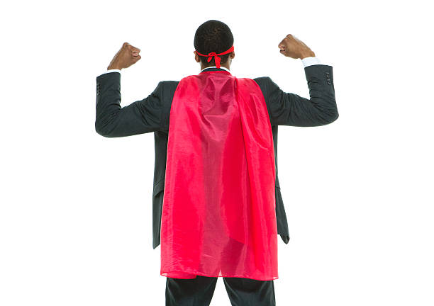 Portrait of Young man (hispter style) with big earring and full beard wearing a superhero costume in action