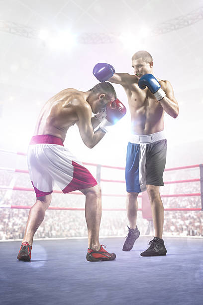 istock Two professionl boxers are fighting on arena 528724141
