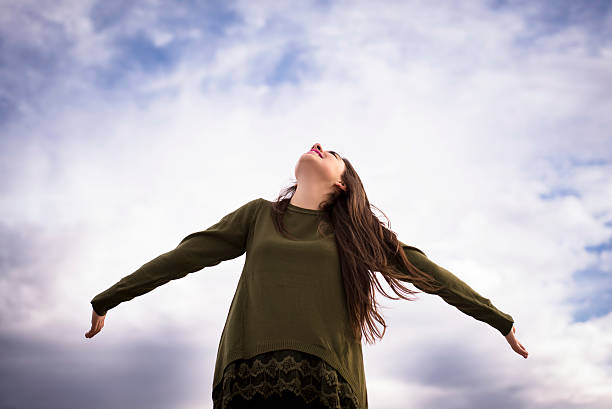 istock Happy girls arms outstreched. 528724183