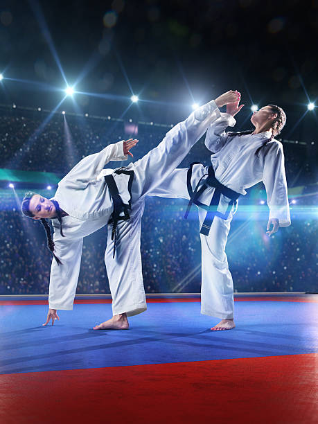 istock Two professional female karate fighters are fighting 528724259