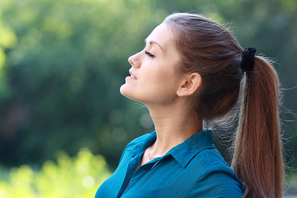 istock woman breathing fresh air 528724421