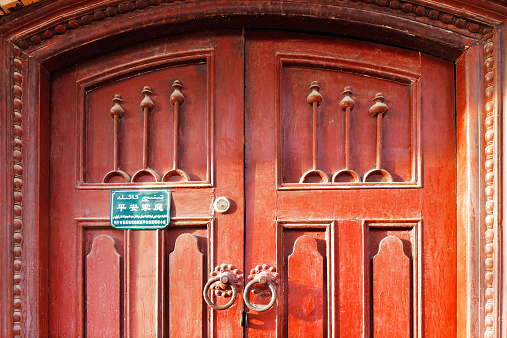 Kashgar, China - July 11, 2014: Ornate doors are very common in the ancient city of Kashgar, China (known in Chinese as Kashi). It is an oasis Chinese city on the silk trading route.
