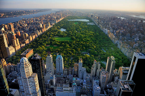 Central Park aerial view, Manhattan, New York Central Park aerial view, Manhattan, New York; Park is surrounded by skyscraper central park manhattan stock pictures, royalty-free photos & images