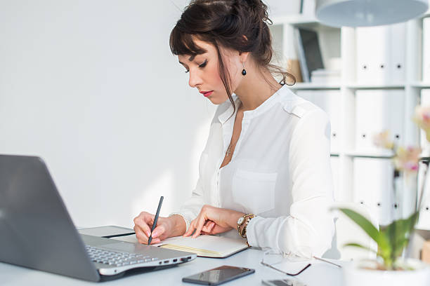 istock Side view portrait of a secretary working at her workplace 528726054
