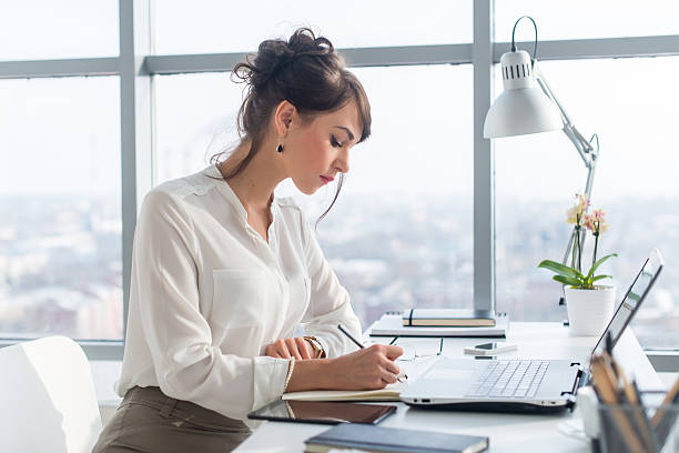 istock Young woman working as an office manager, planning work tasks 528726104