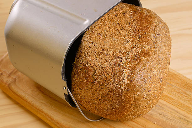 istock Fresh loaf of rye bread on wooden table 528726349
