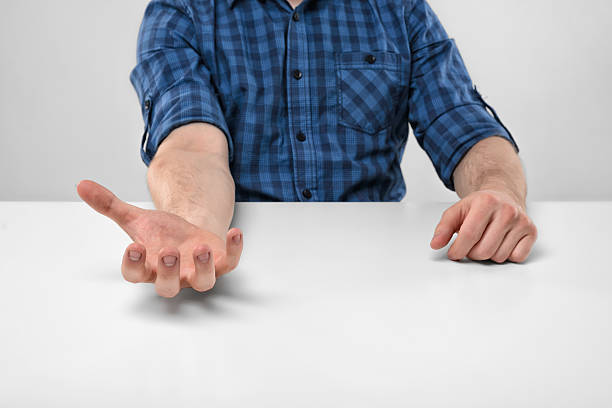 istock Close-up hands of man holding something in his palm 528726578