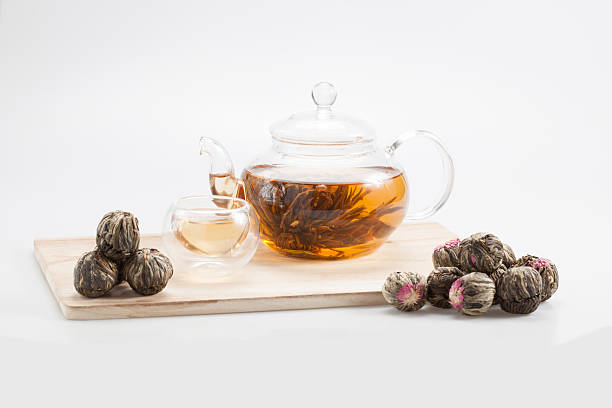 istock exotic green tea with flowers in glass teapot 528727000
