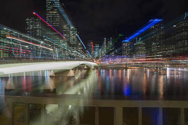 Brisbane, Australia - April 27, 2016: Abstract Brisbane Victoria Bridge catches night lights standing out against the dark night background  with the city lights zoom blurred creating an abstract ethereal image.