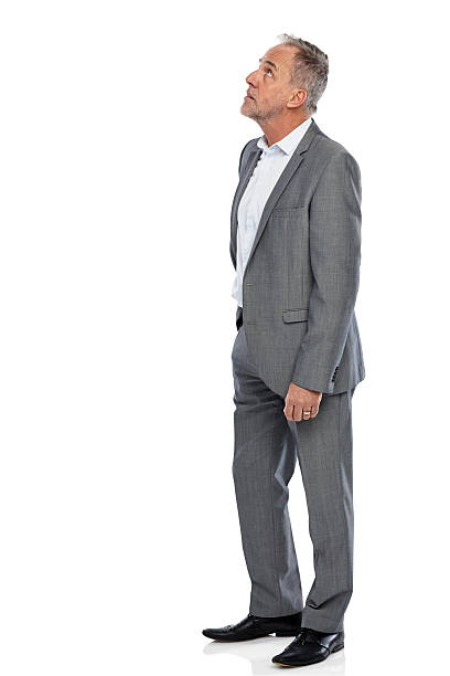 istock Mature businessman looking up at copyspace 528728045