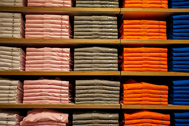 istock colorful T-shirts on store shelf 528728198