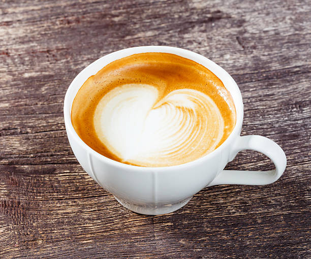 istock Cup of coffee on old wooden table 528729123