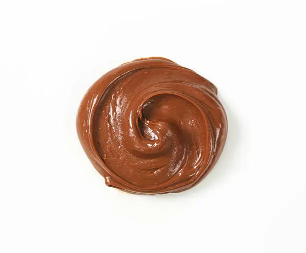 swirl of chocolate spread on white background