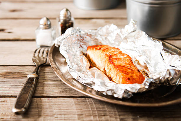 istock Salmon Steak grilled, wrapped in foils that 528729900