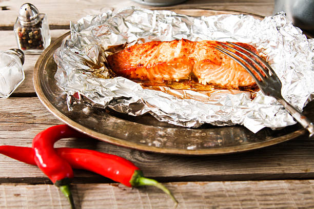 istock Salmon Steak grilled, wrapped in foils that 528730016