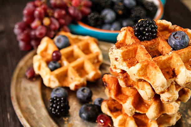 istock Belgian waffles with blueberries and grapes 528733418