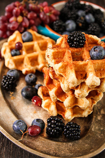 istock Belgian waffles with blueberries and grapes 528733444