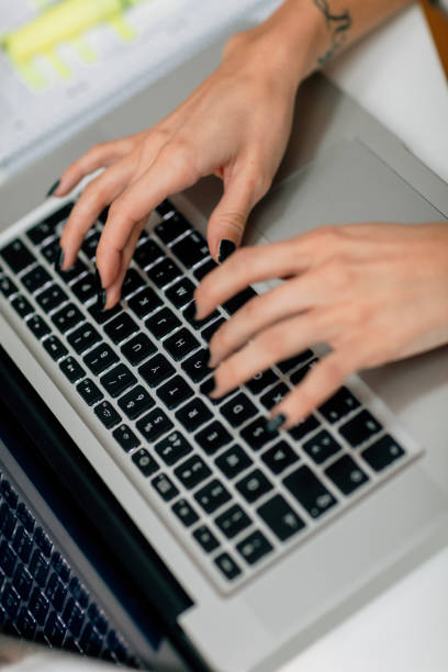 istock Unrecognizable businesswoman using laptop. 528735654