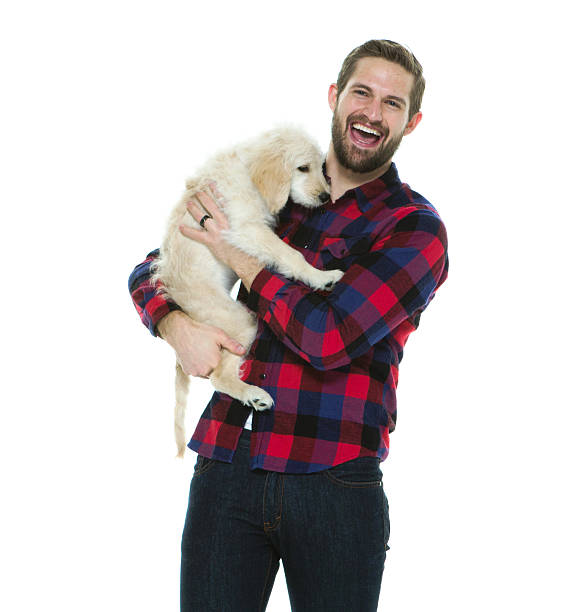 istock Happy man with puppy 528735894
