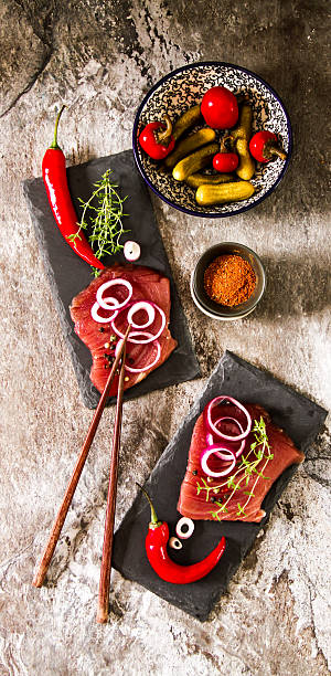 istock tuna steaks on a kitchen board with pepper 528735918