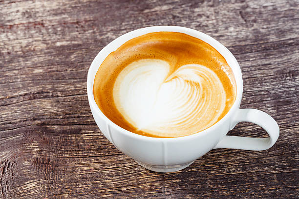 istock Cup of coffee on old wooden table 528738129