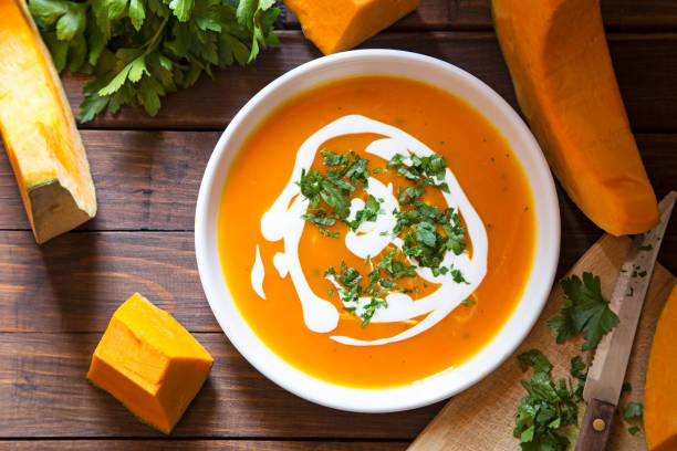 Pumpkin soup Pumpkin soup with the fresh pumpkin and parsley Chowder stock pictures, royalty-free photos & images