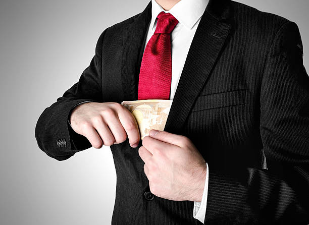 istock Businessman Dressed in Suit Receiving Money. 528739058