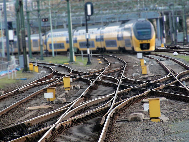 scene of railroad track and high speed train - trein nederland stockfoto's en -beelden