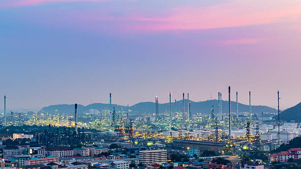 istock Sunset sky over oil refinery and mountain background 528739428