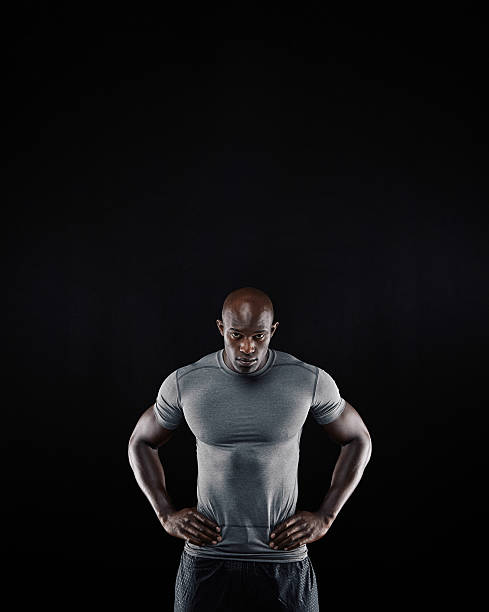 istock Muscular young man in sportswear staring at camera 528739925