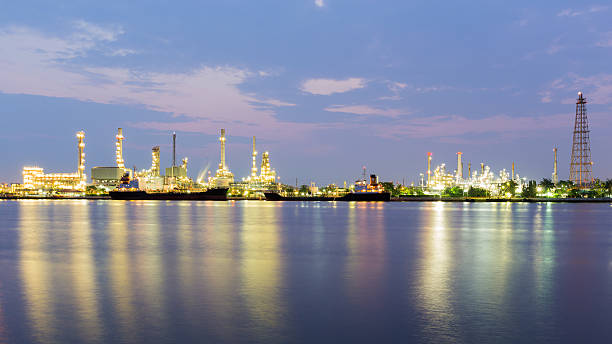 istock Panorama landscape, Oil refinery with river reflection before sunrise 528740030