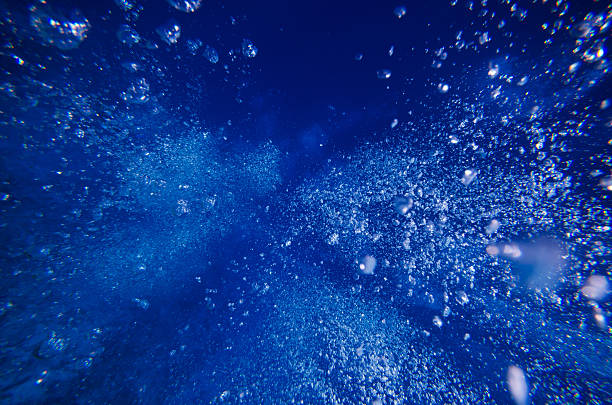 istock Underwater bubble shot in deep blue tropical sea 528740793