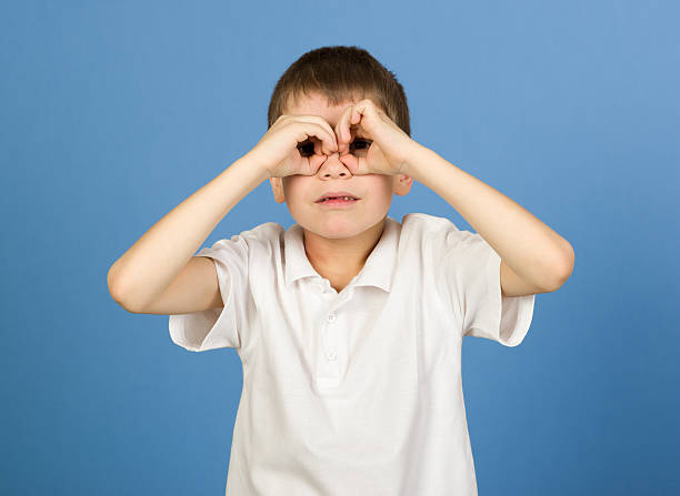 istock boy portrait in white shirt on blue 528740887