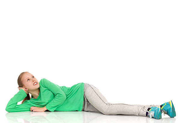 istock Young Girl Lying On A Floor And Looking Up 528741252