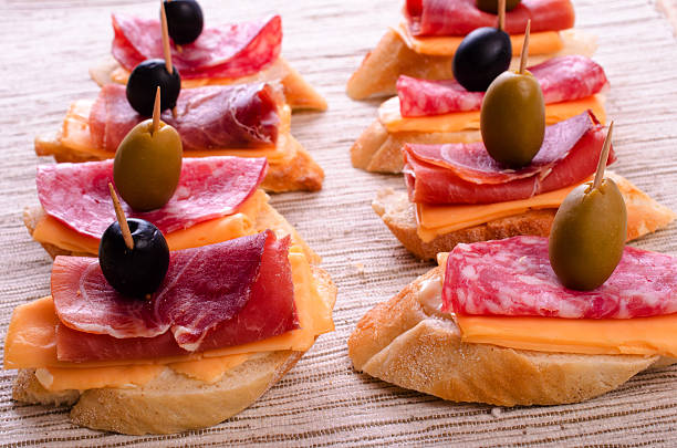 istock Sandwiches with sausage and jamon. 528741316
