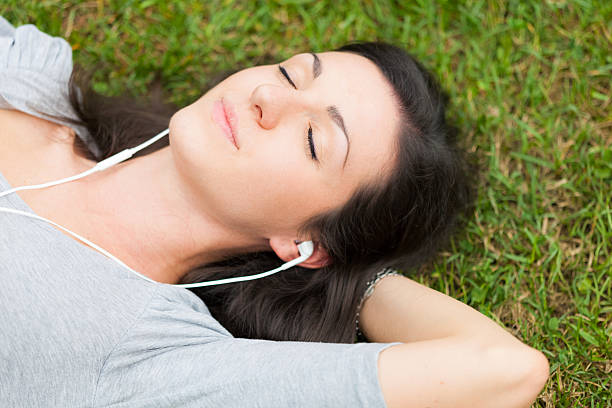 istock Relaxed woman listening music 528742327