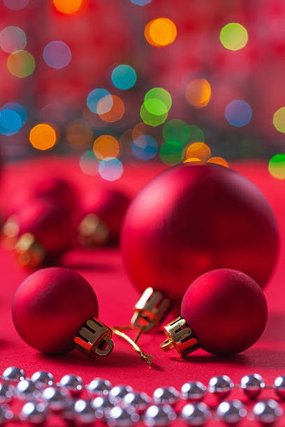 istock composition of red christmas balls on red table 528742345