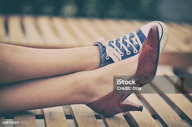 Woman Legs In Different Shoes Stock Photo - Download Image Now - Contrasts, Formalwear, Shoe