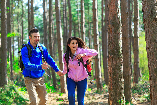 istock Happy couple hiking in the forest 528742914