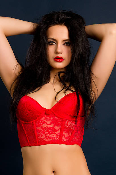 istock woman in beautiful red lingerie 528742973