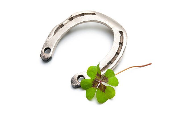 istock Horseshoes and clover with four leaf 528743825