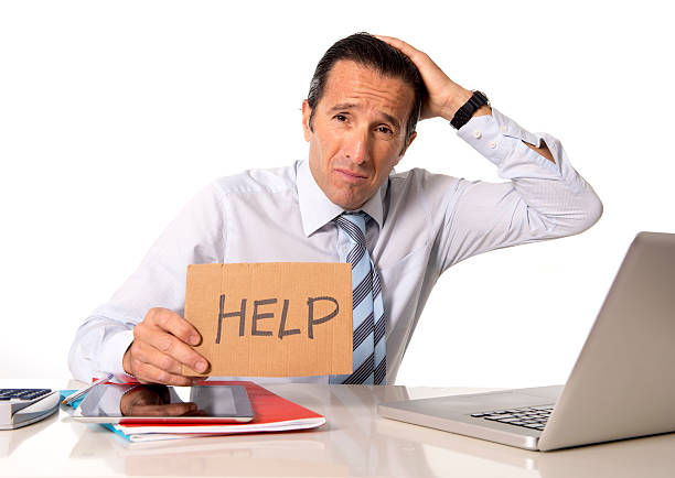 istock senior businessman in crisis working on computer office in stress 528744635