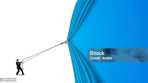 Businessman Pulling Open Blue Curtain With Blank White Backgroun Stock Photo - Download Image Now