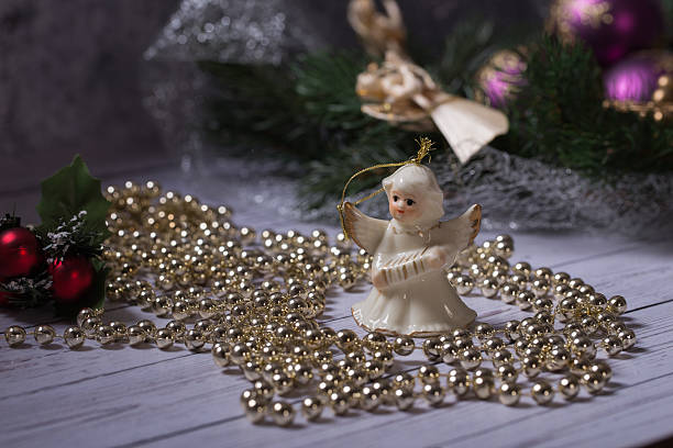 istock Ceramic angel standing on the wood table 528745641