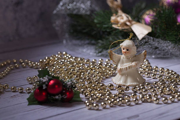 istock Ceramic angel standing on the wood table 528745645