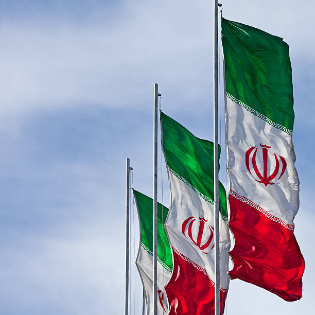 istock Square Cut of Three Iran Flags in the Wind 528762285